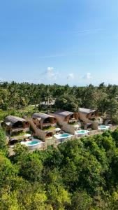 an aerial view of a resort in the jungle at Marilea Bamboo Villas Concept , Private pool, seaview, Adults only in Nusa Penida