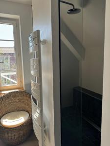a bathroom with a toilet and a glass shower at Charming house in Chantilly in Chantilly