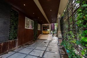 an entrance to a house with a building at The Liverpool Hotels Marathahalli, Outer Ring Road in Bengaluru