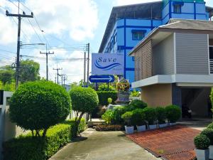 a save sign in front of a building at Save Hotel เซฟ โฮเทล 