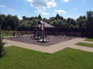 a playground with a slide in a park at Hotel Vulyk in Duliby