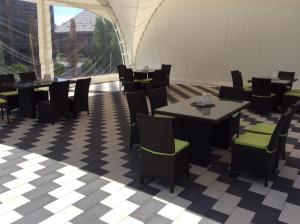 a dining room with tables and chairs in a tent at Hotel Vulyk in Duliby