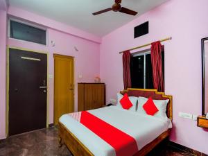 Ένα ή περισσότερα κρεβάτια σε δωμάτιο στο Hotel O Kolkata Palace +46 φωτογραφίες