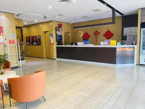 a lobby with a store with a counter and chairs at IU Hotel Tianjin Fumin Qiao Branch in Tianjin