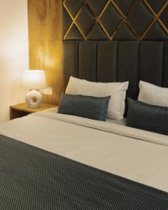 Ένα ή περισσότερα κρεβάτια σε δωμάτιο στο Hotel Maya Elite