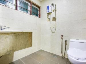 a bathroom with a shower and a toilet at OYO 89571 Eco Palace hotel in Kuala Lumpur +187 photos