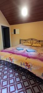 a bedroom with a bed in a room at green Garden Resort in Canacona
