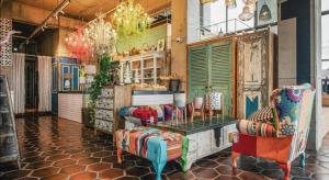 a room with chairs and a table in a store at Tropical Hideaway in Seogwipo