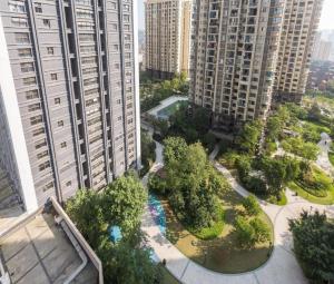 an aerial view of a park with trees and buildings at 7Days Premium Chongqing Jiangbei International Airport Rongchuang in Chongqing