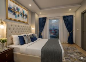 a bedroom with a large bed and a window at Hotel Heaven Luxes Opp Miraj Cinemas in Hyderabad