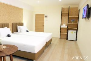 A bed or beds in a room at Area 69 (Don Muang Airport)