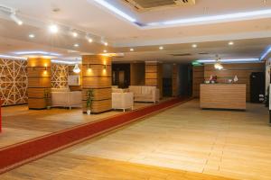 a lobby of a hotel with wooden walls and a salon at Cevaher Hotel & Suıtes in Sancak