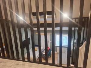 a sliding glass door with a bedroom in a room at Tramway Apartment in Blessington +5 photos