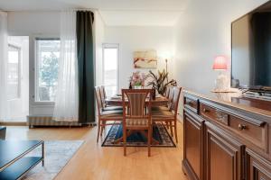 a dining room with a table and chairs at Central Luxury Stay w Vintage Charm & Sauna in Helsinki