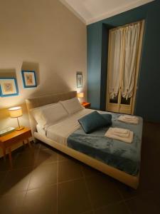 a bedroom with a large bed and a window at Bogino 18 Apartment - Turin in Turin