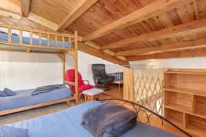 a bedroom with two bunk beds and a desk at Gite Baba in Puget-Ville