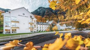 a view of a hotel with mountains in the background at Fretheim Hotel in Flåm