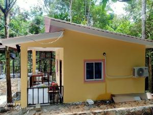 a small yellow house is being built at Rocky Jungle Bungalows in Koh Rong
