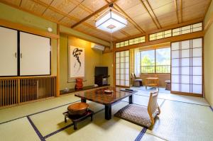 a room with a table and chairs in a room at Yaki no Yu - Vacation STAY 29804v in Takayama