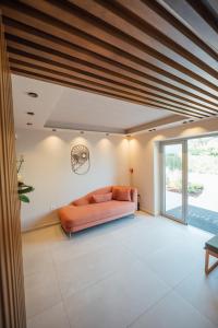 an open living room with a couch and a window at Eterrano Seaside Retreat in Parga +147 photos