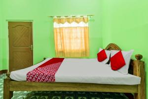 Un pat sau paturi într-o cameră la Hotel O WELCOME RESORT & FAMILY RESTAURANT