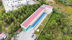 an overhead view of a building with a swimming pool at O Mary River Resort in Sihanoukville