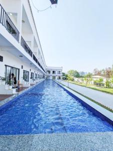 a swimming pool in the middle of a building at O Mary River Resort in Sihanoukville