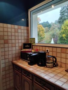 O bucătărie sau chicinetă la Chambre calme et cosy, idéal pour vos déplacements professionnels, ImaginaSoi