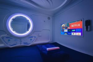 Televiisor ja/või meelelahutuskeskus majutusasutuses Teremok Holiday Homes +4 fotot