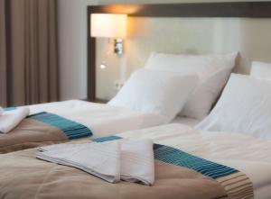 Postel nebo postele na pokoji v ubytování Hotel Ewerdin
