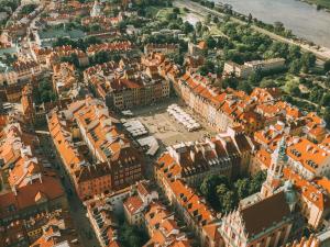 an aerial view of a city with orange buildings at Novotel Warszawa Centrum in Warsaw