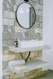 a bathroom with a sink and a mirror at 7 S Villa & Cottage in Kamburugamuwa