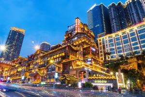 a building in a city with tall buildings at Fanbo Jingcheng Hotel (Hongyadong Branch, Jiefangbei Pedestrian Street, Chongqing) in Nan'an
