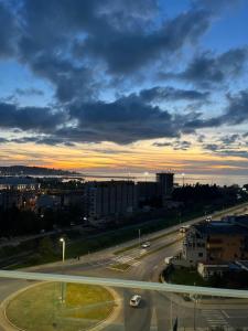 a view of a highway with a sunset in the background at Sea view apartment in Bar