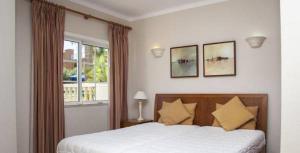 Postel nebo postele na pokoji v ubytování Vila do Castelo + 17 fotografií