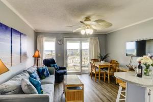 a living room with a couch and a table at SC309A: 309A Sea Cabin in Isle of Palms