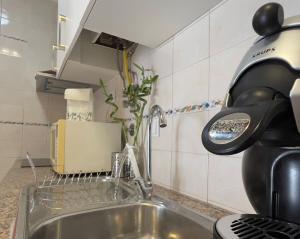 a kitchen counter with a sink and a coffee pot at Countryside Home by Trip2Portugal in Sobral da Abelheira +14 photos