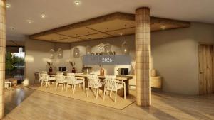 a restaurant with a table and chairs in a room at Cala Millor Garden Hotel - Adults Only in Cala Millor +50 photos