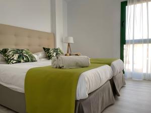 a bedroom with a bed with a teddy bear on it at Espectacular Y Amplio Las Américas in Playa de las Americas +36 photos