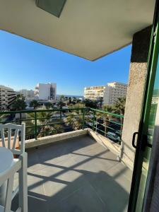a balcony with a view of a city at Espectacular Y Amplio Las Américas in Playa de las Americas
