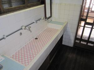 Koupelna v ubytování Taito Ryokan