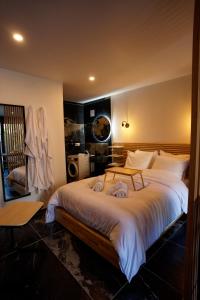 a bedroom with a large bed in a room at Instinct Sauvage - Nature & Jacuzzi privatif in Verdun
