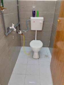 a small bathroom with a toilet in a stall at Homestay Bajet Kg Telaga Mas Paka in Paka