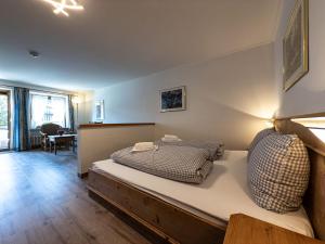 a bedroom with a bed in a room at FEWO Geierhos in Steibis