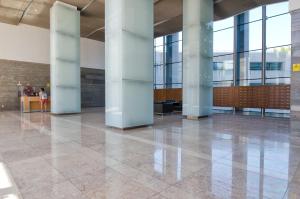 a large lobby with columns in a building at Expo Studio in Lisbon