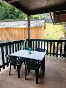 a white table and chairs on a patio at Gasthof Zaunerhof - Hotels en Appartementen in Grünau im Almtal