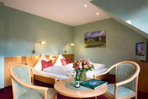 Posezení v ubytování Weinhotel Offenstein Erben