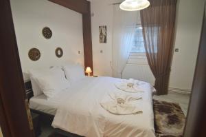 Ένα ή περισσότερα κρεβάτια σε δωμάτιο στο Dimitras Kalithea