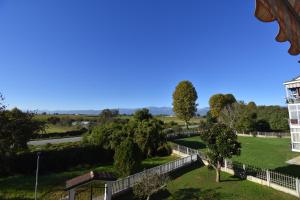 a view of a park with trees and a building at A casa di Gina in Airasca