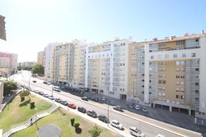 an aerial view of a street with buildings and cars at Quinta das Conchas Apartment by Trip2Portugal in Lisbon